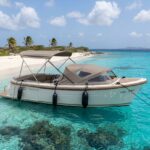 Primeur 615 boat anchored off Klein Bonaire, available to rent via Caribbean Rentals