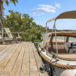 Lounge chairs on the Ocean Breeze dock next to the boat