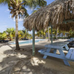 Palapa and picnic table next to the Ocean Breeze pool